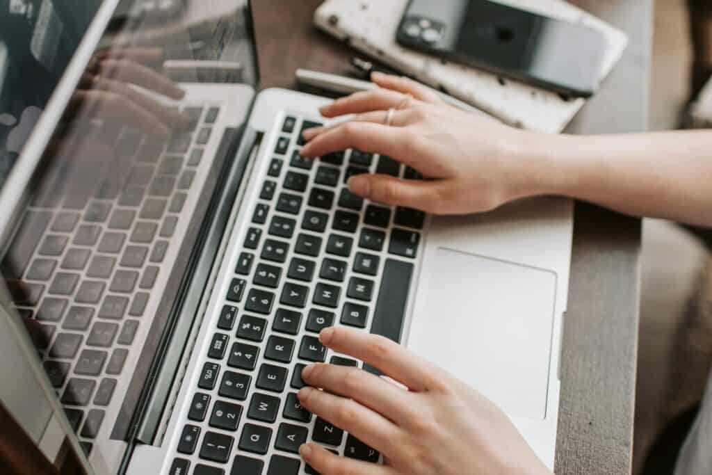 A woman is registering for affordable housing through her laptop