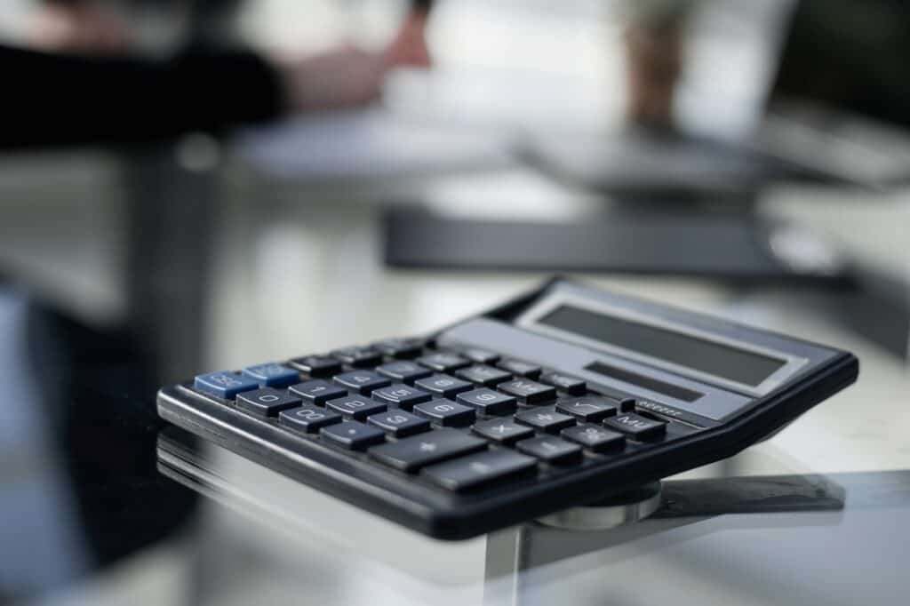 A black digital calculator used for budgeting