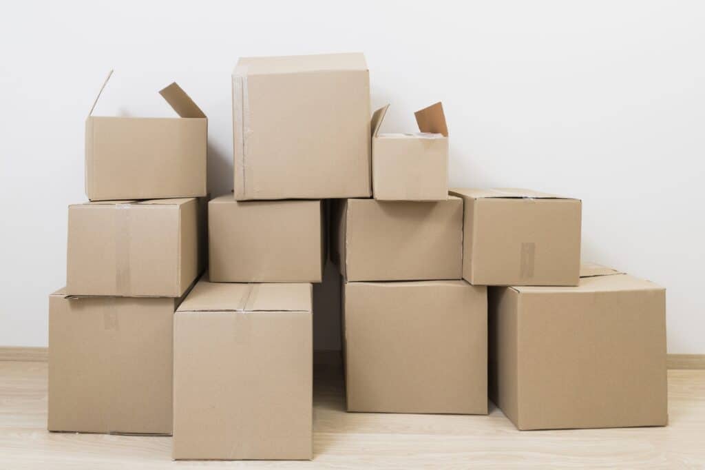 Stacks of used boxes in the concept of 'what to do with packing materials after moving house to South London'.